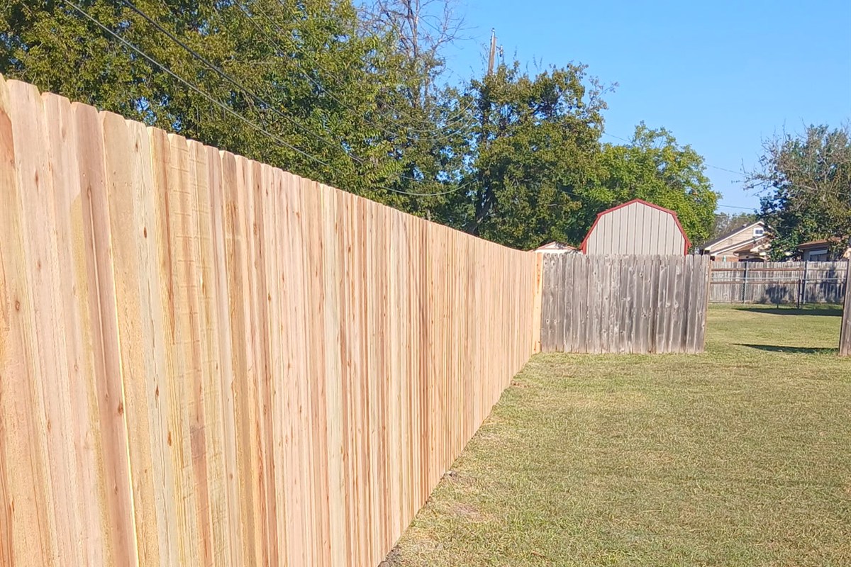 New privacy fence run after wind damage repair